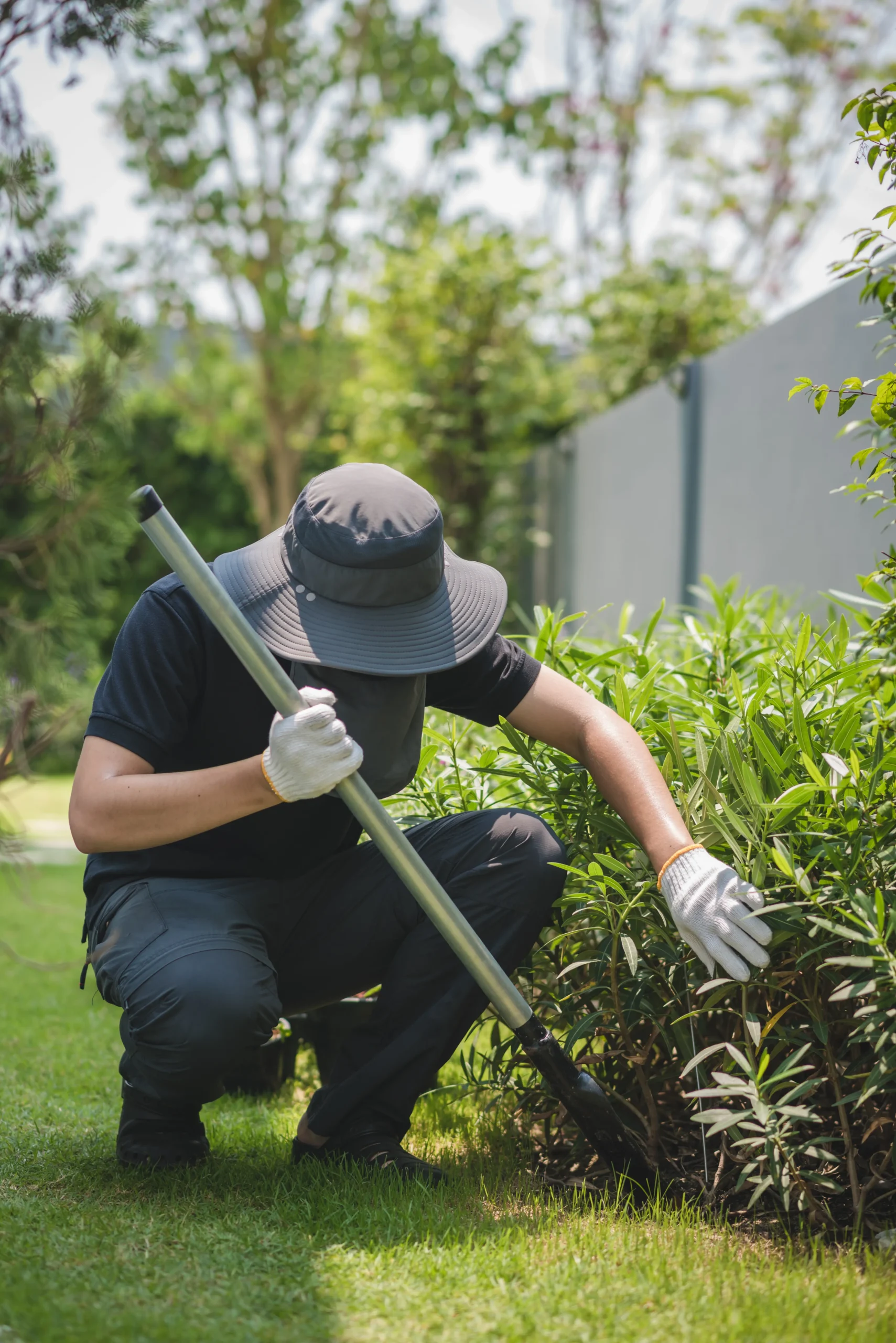 asian-male-shoveling-backyard_11zon