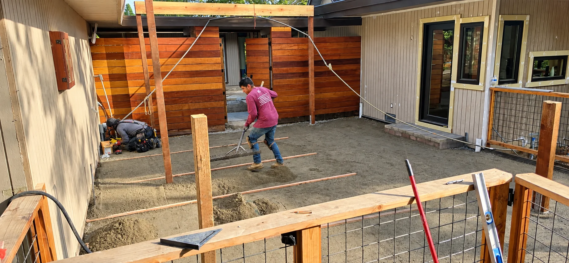 paver-patio-sand-base-leveling-redwood-fence
